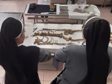 Religious sisters view remains discovered at a site in Gdańsk, northern Poland.